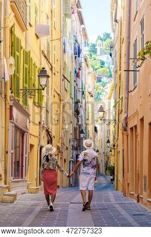 Menton France, Couple Men And Woman On Vacation At The Cote D Azur France, View On Old Part Of Mento