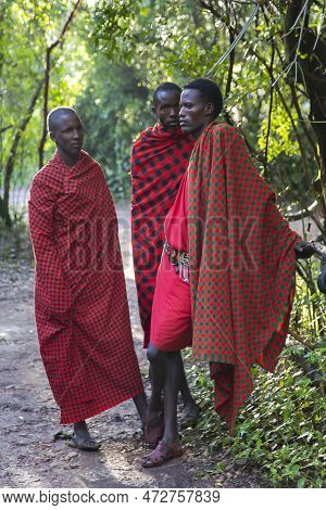 Africa, Tanzania, May, 2016 - A Maasai Tribesmens In Traditional Attire On A Savannah Path In Tanzan