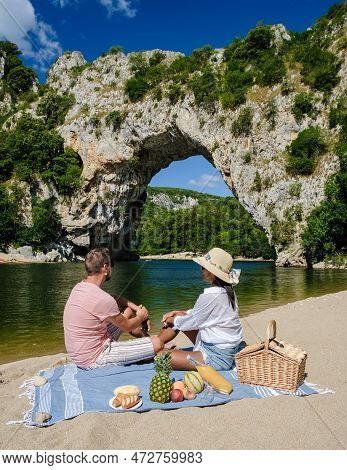 Couple On Vacation In The Ardeche France Pont D Arc, View Of Narural Arch Pont Darc Canyon France