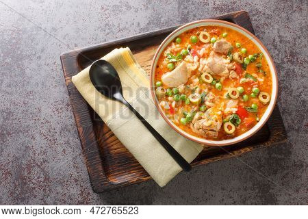 Asopao De Pollo Is A Caribbean Dish That Consists Of Sofrito, Rice, Tomato Paste, And Bite Sized Pie
