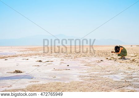 Caucasian Woman Blogger Tourist Capture Maharlu Pink Salt Lake Structures On Holidays. Travel Destin