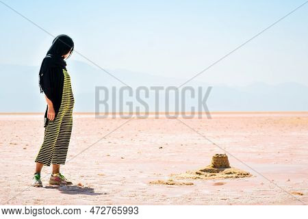 Caucasian Woman Tourist Stand On Maharlu Pink Salt Lake Shore. Travel Destination Iran In Shiraz