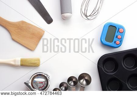 Top View Set Of Kitchen Utensils And Ingredients For Bakery On White Background. Materials Or Kitche