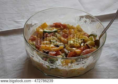 Glass Bowl With A Mixed Colorful Salad