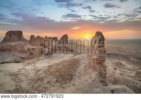 Ruins Of Ancient Khorezm Fortress Ayaz Kala In Kyzylkum Desert On Sunrise, Uzbekistan