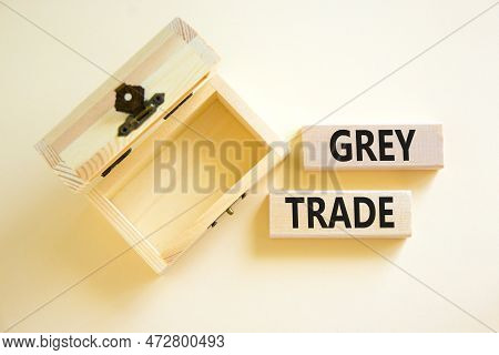 Grey Trade Symbol. Concept Words Grey Trade On Wooden Block. Beautiful White Table White Background.