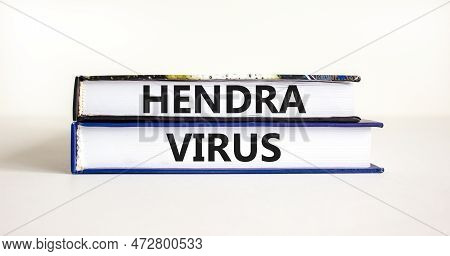 Hendra Virus Symbol. Concept Words Hendra Virus On Books. Beautiful White Table White Background. Me
