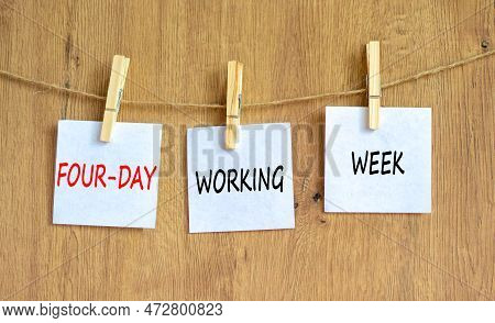 Four-day Working Week Symbol. Concept Words Four-day Working Week On White Paper On A Beautiful Wood