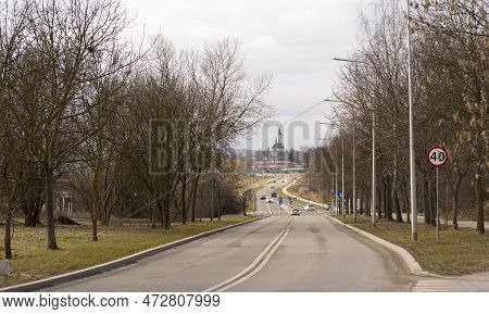 The Streets Of My City In Early Spring . Road In Suburban Areas. A White Church Tower With A Clock C