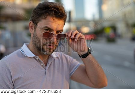 Young Handsome Man In Classik Polo T-shirt On The Street. Handsome Confident Stylish Hipster Model P