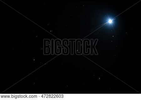 Night Sky Background With Bright Sirius Star On Black Sky With Stars. Astro Photo On Winter Night Wi