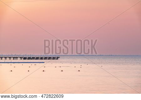 Background Of Sky And Sea, Sea Is Very Calm With Gentle Ripples, Sky Perfectly Clear. Calm Sea And B