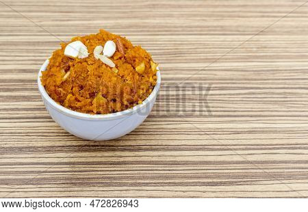 Authentic Homemade Gaja Ka Halva Or Carrot Halwa Garnished With Cashew And Almond Nut Cuts Isolate O