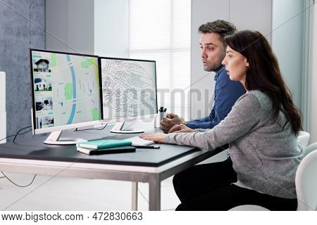 Developer Looking At Land Plot Map And Cadastre Plan
