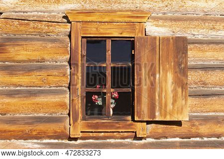 Window With Shutters In A Wooden House. Ancient Wooden Architecture. Irkutsk Architectural And Ethno