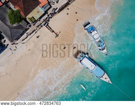 Aerial Shoreline View Of Jungutbatu Beach At Nusa Lembongan With Tourist Speedboat Anchored. One Of 