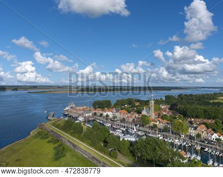 Aerial View With City View Of Veere With The Historical City Hall And The Historical City Fortificat
