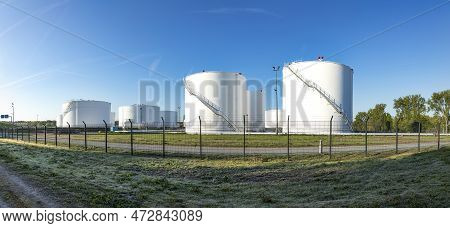 Huge White Silos In A Silo Farm With Petrol