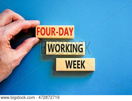 Four-day Working Week Symbol. Concept Words Four-day Working Week On Wooden Block On A Beautiful Blu