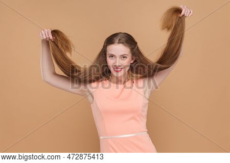 Portrait Of Happy Positive Optimistic Woman With Long Hair Being In Very Good Mood, Having Fun, Pull