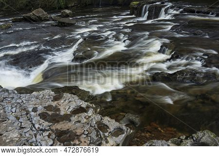 Beautiful Peaceful Landscape Image Of Aysgarth Falls In Yorkshire Dales In England During Winter Mor
