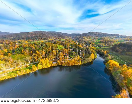 Fojtka Water Reservoir Surrounded By Vibrant Colored Forest At Autumn Time. Aerial View From Drone.