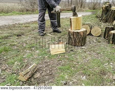 Chopping Firewood Before Winter - Man, Axe And Wood. A Man Chops Wood. The Process Of Chopping Wood 