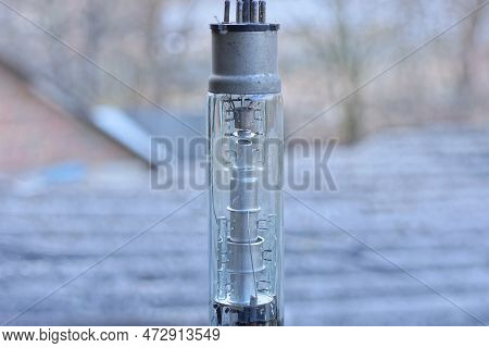 Part One Of A Long Glass Old Lamp On A Kinescope Tube Of A Retro Tv On A Gray Background