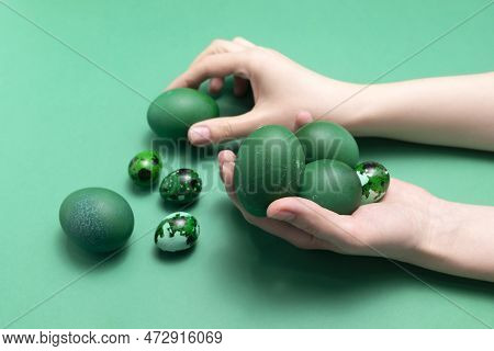Female Hands Holding Blue Green Easter Chicken Quail Eggs On Blue Background. Pascha Or Resurrection