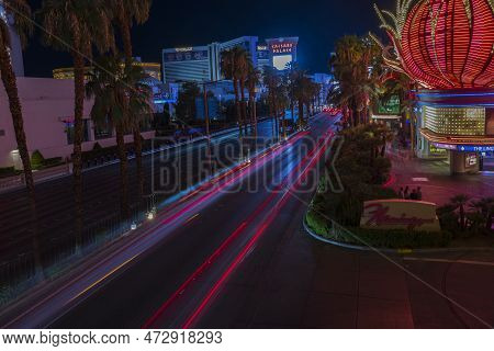 View Of Out-of-focus Strip Road Tracers. Night View Of Las Vegas Cityscape With Defocused Light Trac