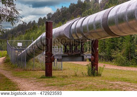 Goldstream, Alaska, Usa - July 26, 2011: Alyeska Trans-alaska Pipeline Viewing Point. Shiny Metal Lo