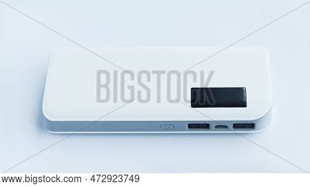A White Flat Power Bank Isolated On White Background With Two Usb Output And One Input Socket Electr