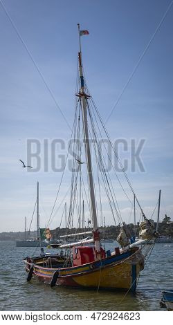 Alvor, Portugal, March 2023 - Portuguese Fishing Boat In The Harbor At Alvor, Algarve, Portugal