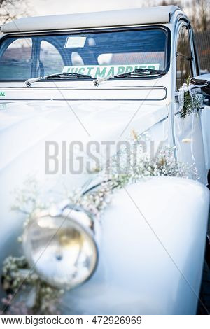 Wedding Car Of Newly Married Couple With Authentic Details And Styling Flowers