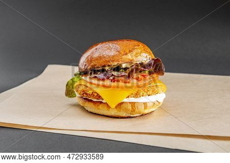 Crispy Chicken Fillet Burger With Cheddar Cheese With Mayonnaise And Mustard, Tomato Slices And Purp