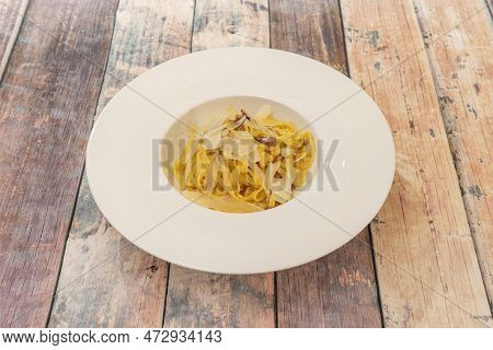 Carbonara Noodles With Guanciale And Parmesan Cheese Flakes Cooked By Italian Chef