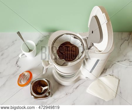 Coffee Brewer Paper Filter Filled With Ground Coffee. Preparing Automatic Drip Coffee Maker For Brew