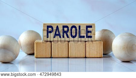 Parole - Word On Wooden Cubes On A Light Background With Balls. Info Concept