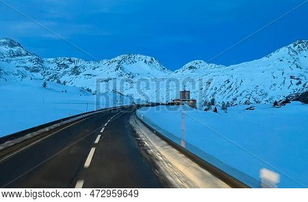 A Road On Top Of A Snowy Mountain In Simplon, Switzerland