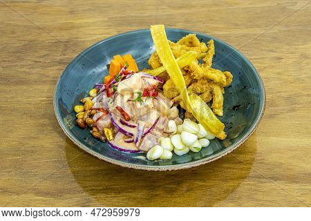 Nice Blue Bowl With Peruvian-style Corvina Ceviche With Battered Squid And Corn Kernels