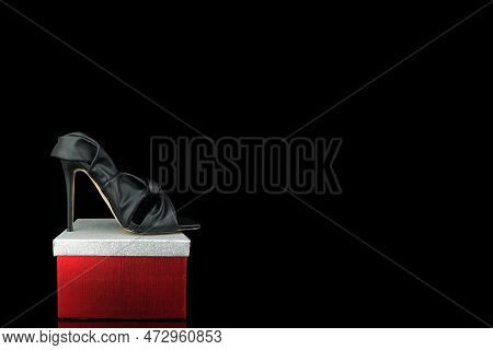 High Heel Shoes  On A Black Background