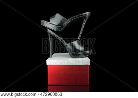 High Heel Shoes  On A Black Background