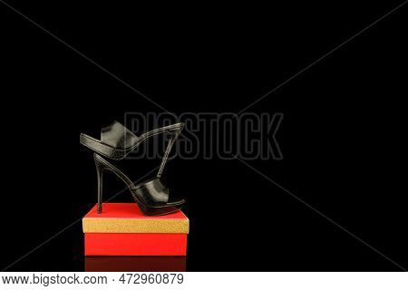 High Heel Shoes  On A Black Background
