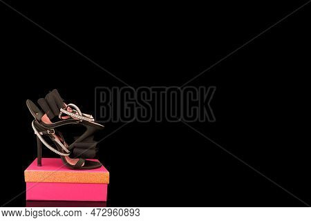 High Heel Shoes  On A Black Background