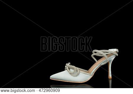 High Heel Shoes  On A Black Background