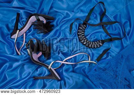 High Heel Shoes  On A Blue Background