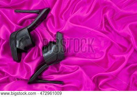 High Heel Shoes  On A Pink  Background