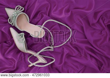 High Heel Shoes  On A Pink  Background