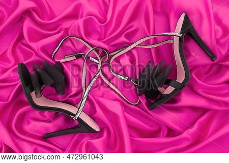 High Heel Shoes  On A Pink Background