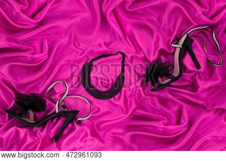 High Heel Shoes  On A Pink  Background